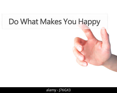 Do What Makes You Happy - Hand pressing a button on blurred background concept . Business, technology, internet concept. Stock Photo Stock Photo