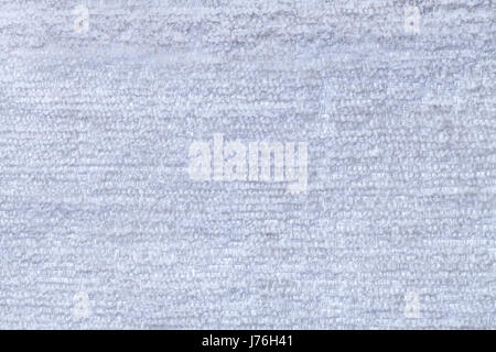 Sky blue fluffy background of soft, fleecy cloth. Texture of light cerulean nappy textile, closeup. Stock Photo