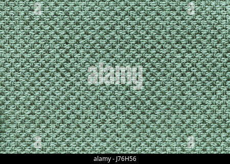 Light turquoise background with checkered pattern, closeup. Structure of the green fabric macro. Stock Photo