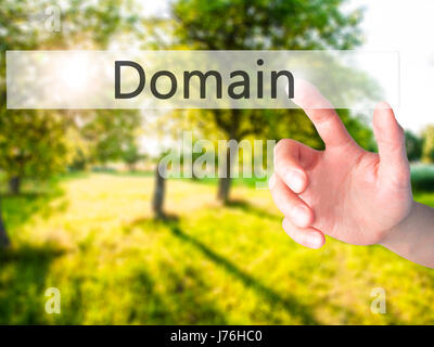 Domain - Hand pressing a button on blurred background concept . Business, technology, internet concept. Stock Photo Stock Photo