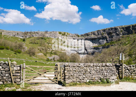 Gate and footpath access to Malham Cove following the Pennine Way. Malham Malhamdale Yorkshire Dales National Park North Yorkshire England UK Britain Stock Photo