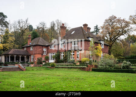 External facade of a victorian rectory with large garden lawn Stock Photo