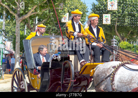 Seville, Spain - May 02, 2017: Traditional riding horse carriages celebrating Seville's April Fair. Stock Photo