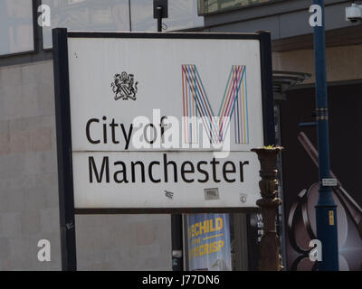 Manchester, UK. 23rd May, 2017. A City of Manchester sign behind the police cordon, the day after a suicide bomb attack killed 22 as crowds were leaving the Ariana Grande concert at the Manchester Arena. Credit: Chris Rogers/Alamy Live News