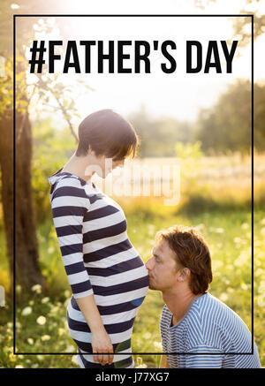 Young father kissing belly of his pregnant wife. Fathers day. Stock Photo