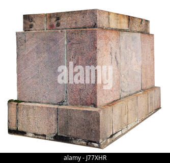 The base for a old statue or a column is made of roughly processed granite aged blocks. Isolated on white Stock Photo