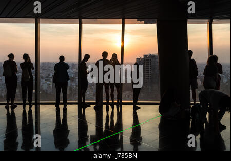HO CHI MINH CITY, VIETNAM - APRIL 15: Tourists enjoy the view from an observatory in a tall building in Ho Chi Minh City in Vietnam largest city Stock Photo