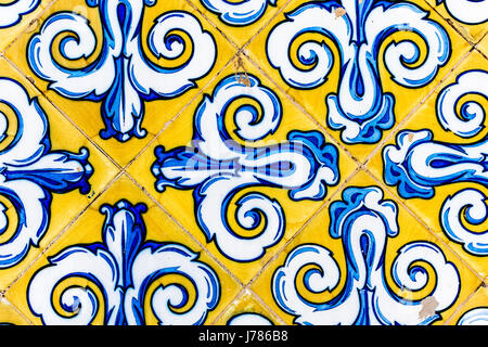 Colorful Vintage Style Ceramic Tile Pattern Texture and Background. Yellow, Blue and White Tiles for Floors and Walls. Stock Photo