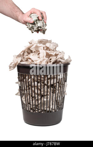 Throwing money in the trash can Stock Photo