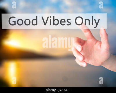 Good Vibes Only - Hand pressing a button on blurred background concept . Business, technology, internet concept. Stock Photo Stock Photo