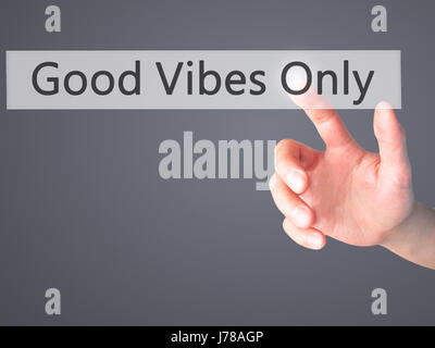 Good Vibes Only - Hand pressing a button on blurred background concept . Business, technology, internet concept. Stock Photo Stock Photo