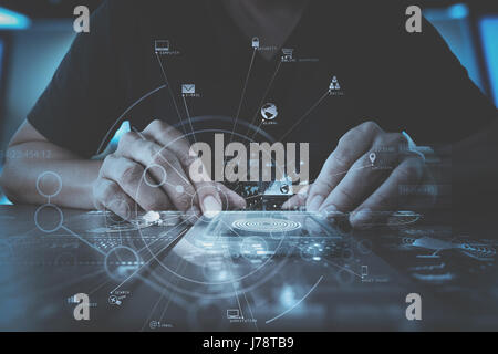 businessman hand working with modern smartphone computer in modern office with virtual icon diagram Stock Photo