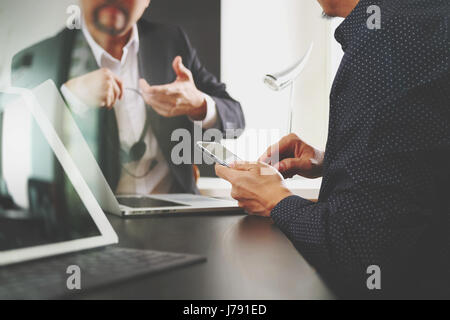 co working team meeting concept,businessman using smart phone and digital tablet and laptop computer in modern office Stock Photo