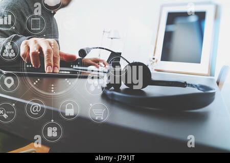 Man using VOIP headset with digital tablet computer as concept communication or it support or call center and customer service in modern office with v Stock Photo