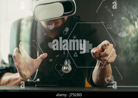 businessman wearing virtual reality goggles in modern office with mobile phone using with VR headset with screen icon diagram Stock Photo