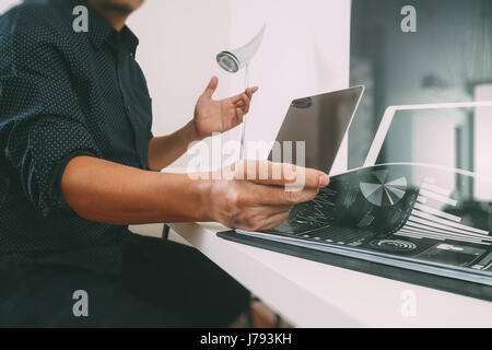 businessman working with smart phone and digital tablet and laptop computer and document in modern office Stock Photo