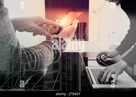 co working team meeting concept,businessman using smart phone and digital tablet and laptop computer in modern office with London city exposure Stock Photo