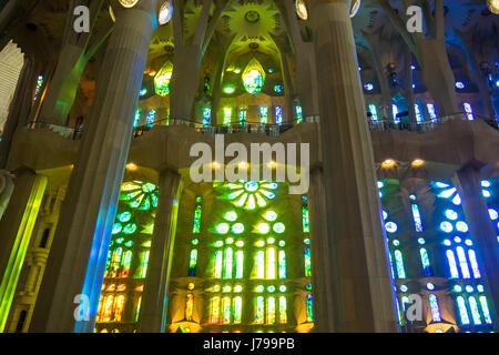 Decorative stained glass windows and columns in Gaudi's Sagrada Familia Basilica in Barcelona Spain. Stock Photo