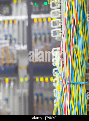 stack of colorful electronic wire in socket board of ditig tal telecommunication control room Stock Photo