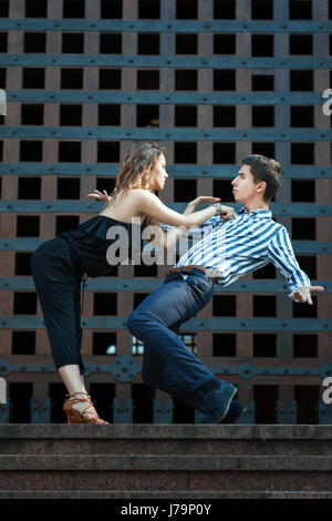 Young couple dancing the tango. They play emotions. See more photos of this series. Stock Photo