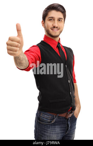 Tattooed young man making a thumb up gesture isolated on white background Stock Photo