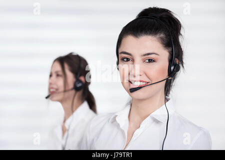 Female call center operator working in office Stock Photo