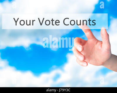 Your Vote Counts - Hand pressing a button on blurred background concept . Business, technology, internet concept. Stock Photo Stock Photo