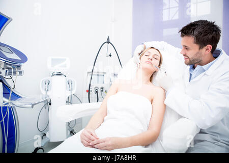 Aesthetic surgery, woman receiving injection into lip Stock Photo