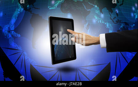 hand of businessman pointing to tablet with satelite dish and world map  background Stock Photo