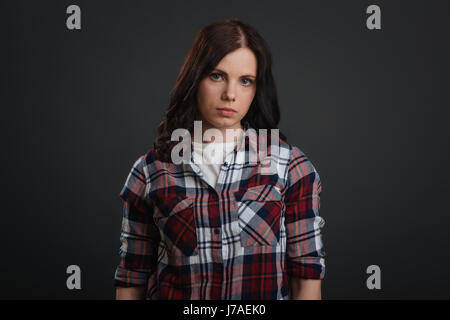 Strong confident young woman looking sad Stock Photo