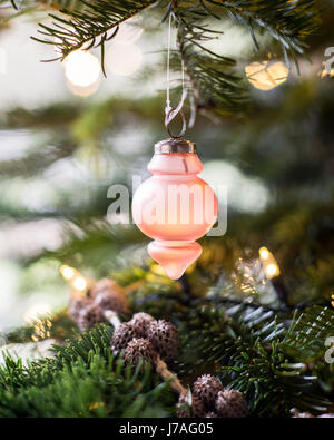 Detail of a pink Danish glass ornament on a christmas tree Stock Photo