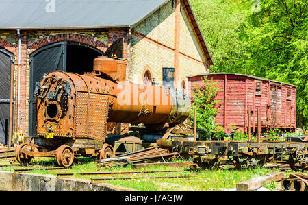 Brosarp, Sweden - May 18, 2017: Documentary of public historic railway station area. Rusty old water tank and furnace of steam locomotive standing out Stock Photo