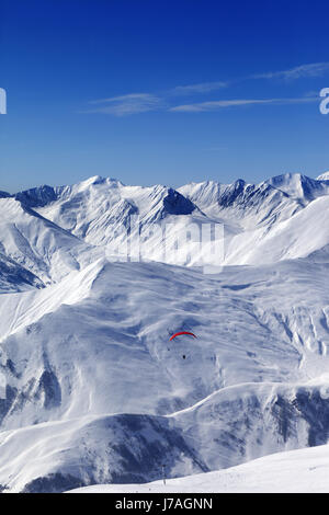 Speed flying in sun day. Caucasus Mountains, Georgia, ski resort Gudauri. Stock Photo