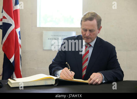 Irish Taoiseach Enda Kenny signs a book of condolence at the British Embassy in Dublin for those affected by the attack in Manchester. Stock Photo