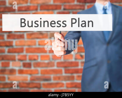 Business Plan - Business man showing sign. Business, technology, internet concept. Stock Photo Stock Photo