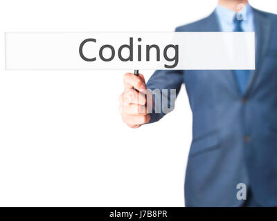 Coding - Business man showing sign. Business, technology, internet concept. Stock Photo Stock Photo