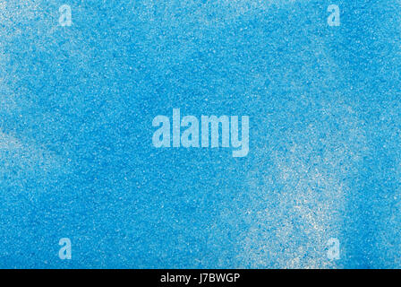 Abstract texture of blue sand scattered on the surface Stock Photo