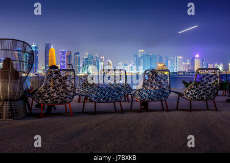 Doha skyline view at night from lounge bar in MIA Park Doha, Qatar, Middle East. Stock Photo