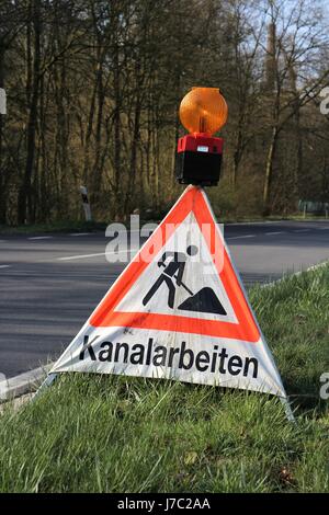 German road sign: construction site - working at sewer system Stock Photo