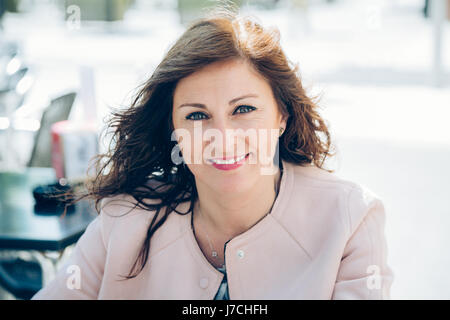 Portrait of a beautiful, happy and smart business woman taking a break outdoors Stock Photo