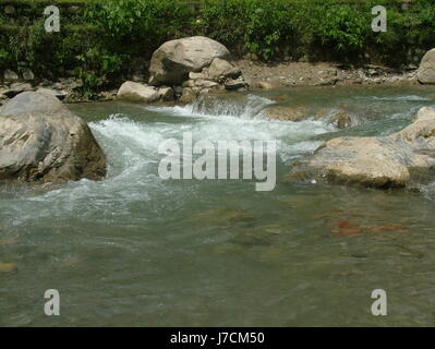 Gange / Ganga River. Rocky Pebble, Rock Mountain, nature, rock, river, stream, flowing, Rishikesh, Himalaya (Photo Copyright © Saji Maramon) Stock Photo