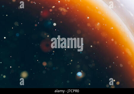 abstract outer space concept colorful liquids on water dark background Stock Photo