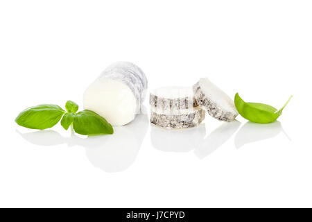 Goat cheese with basil isolated on white background. Culinary cheese eating. Stock Photo