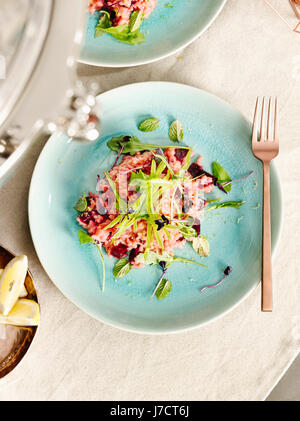 Beetroot risotto with sugar snaps Stock Photo