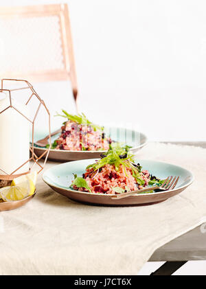 Beetroot risotto with sugar snaps Stock Photo