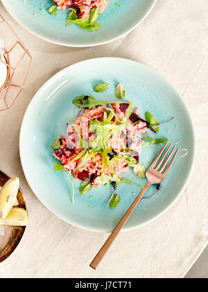 Beetroot risotto with sugar snaps Stock Photo