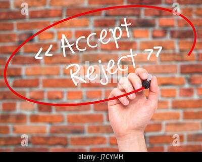 Man Hand writing Accept - Reject  with black marker on visual screen. Isolated on background. Business, technology, internet concept. Stock Photo Stock Photo