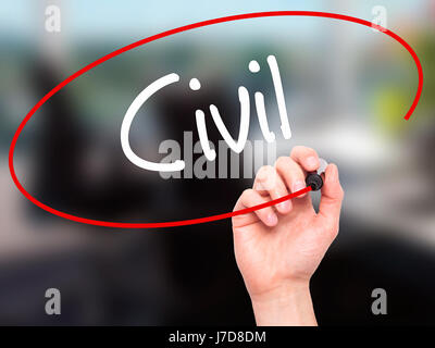 Man Hand writing Civil with black marker on visual screen. Isolated on background. Business, technology, internet concept. Stock Photo Stock Photo