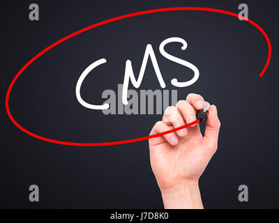 Man Hand writing CMS (Custom Management System) with black marker on visual screen. Isolated on background. Business, technology, internet concept. St Stock Photo