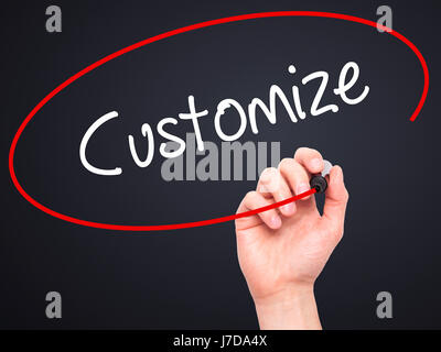 Man Hand writing  Customize with black marker on visual screen. Isolated on black. Business, technology, internet concept. Stock Photo Stock Photo